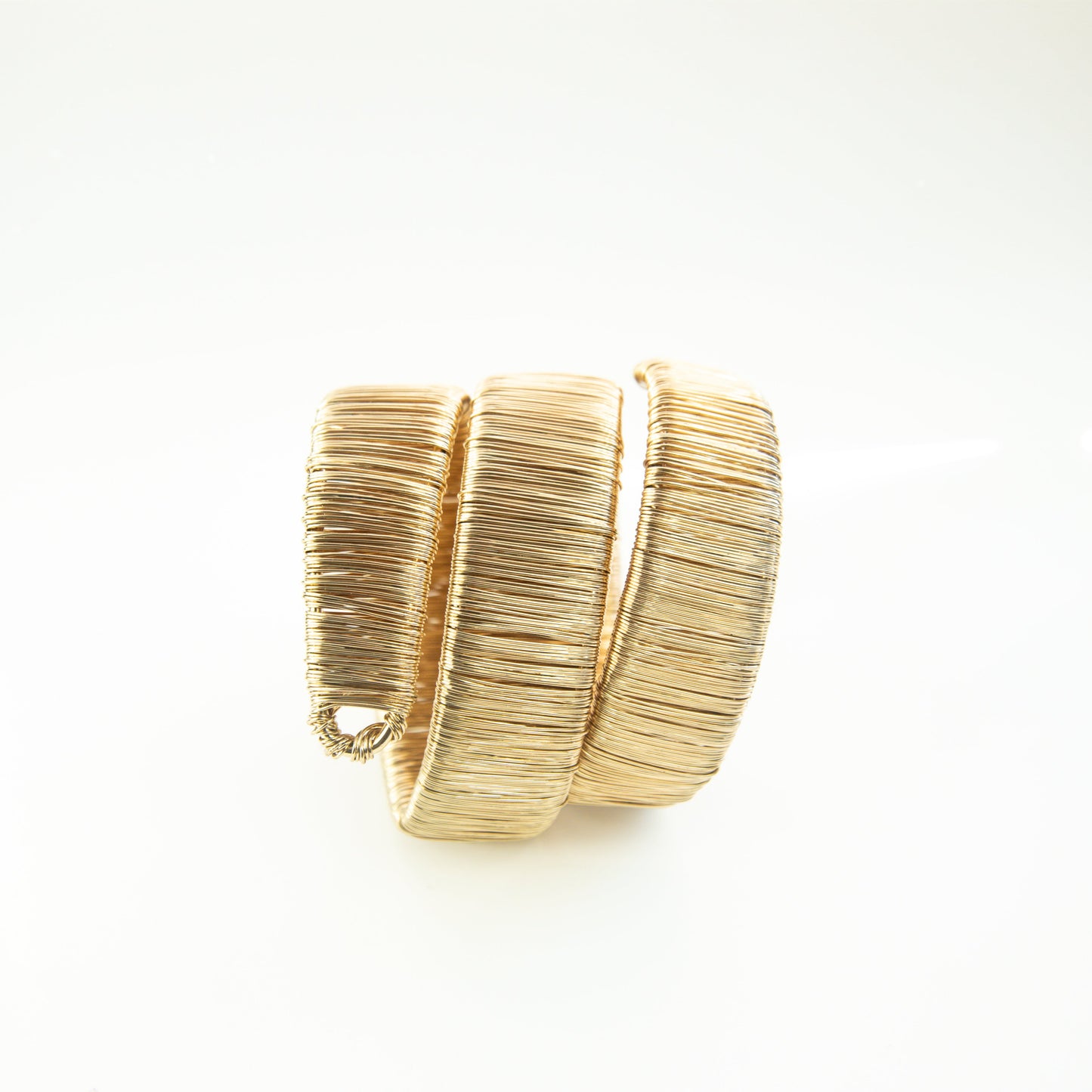 Gold bracelet on a white background