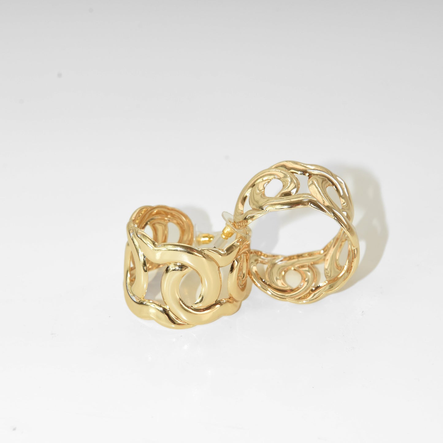 Gold hoop earrings on a white background