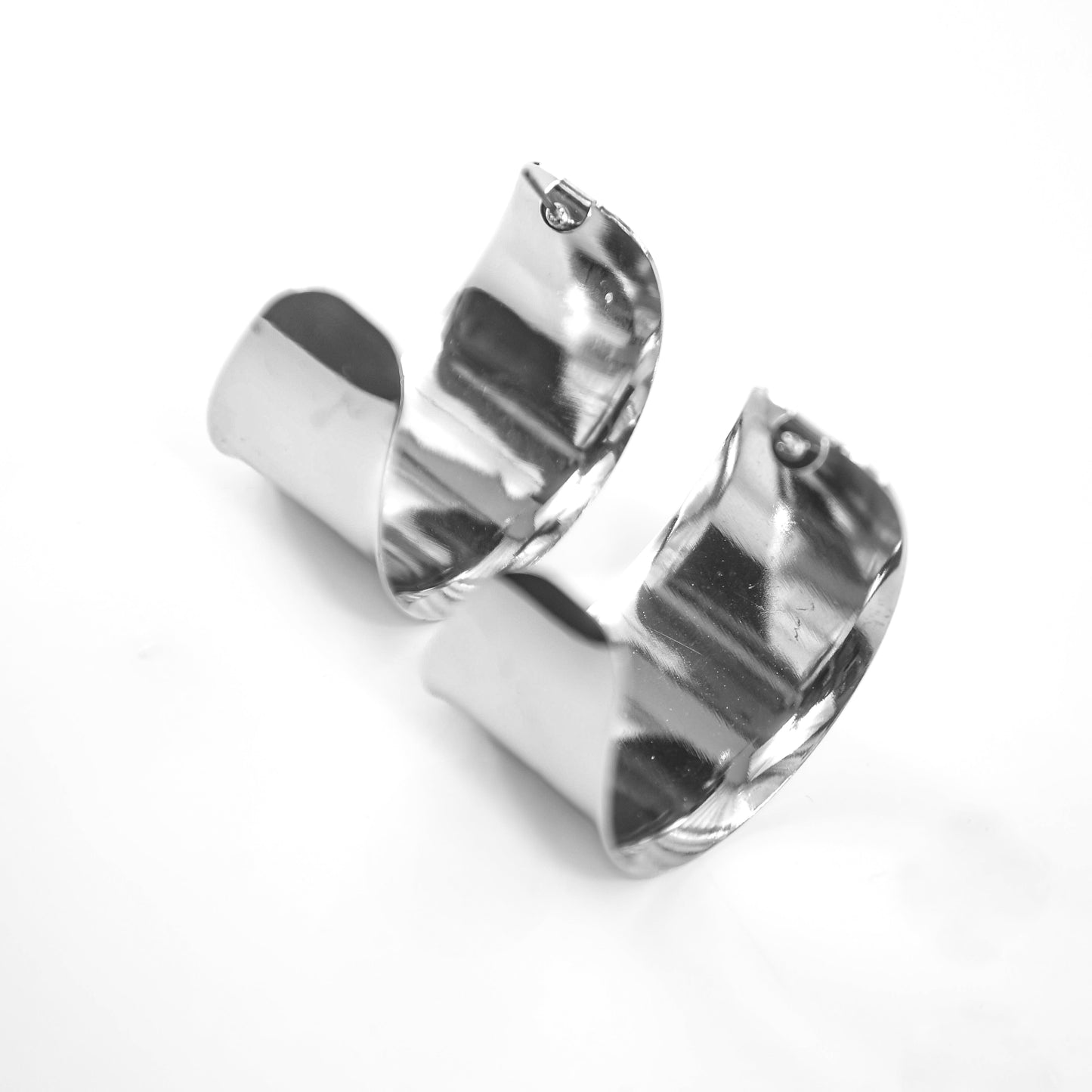 Pair of silver hoop earrings on a white background