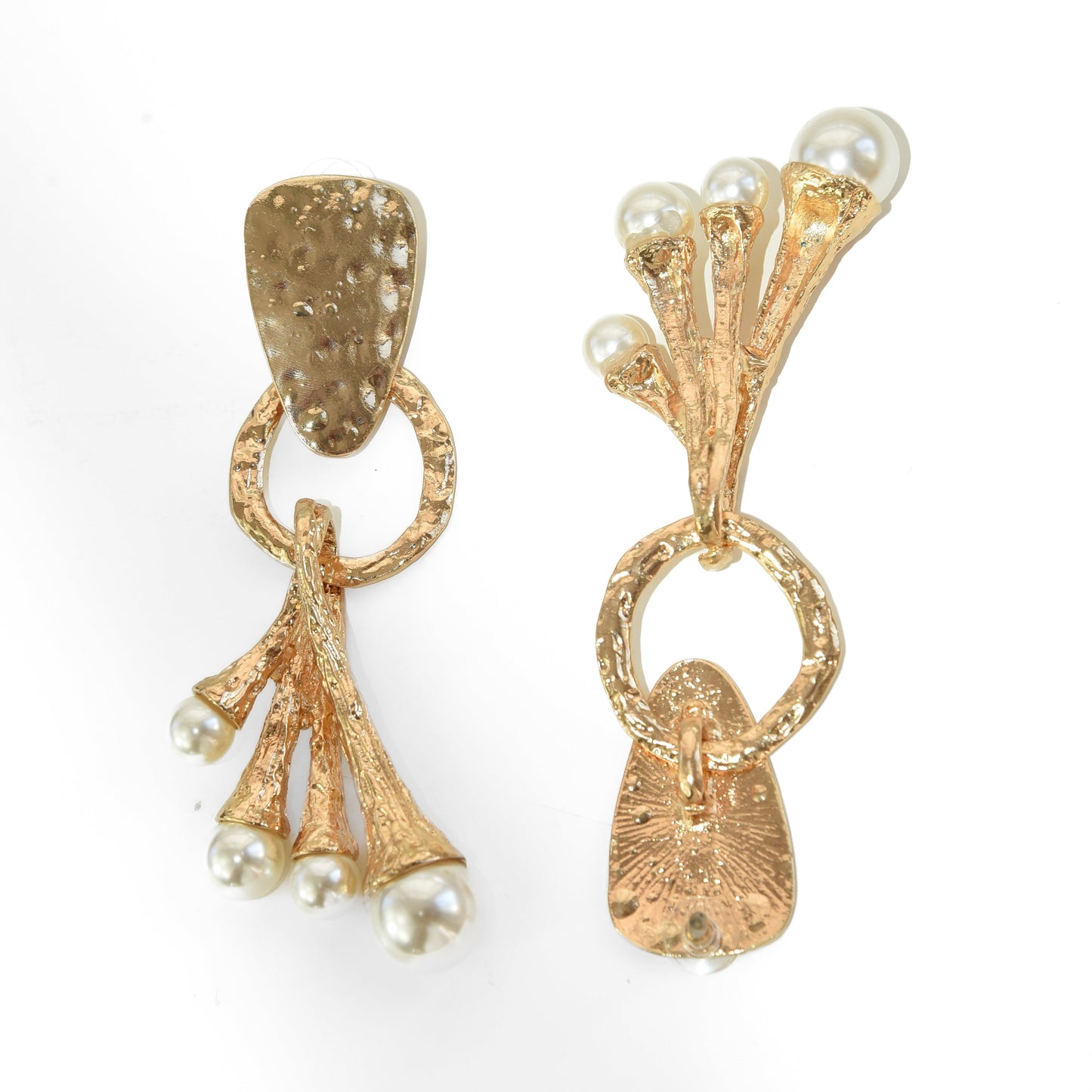 Gold earrings with pearl accents on a white background