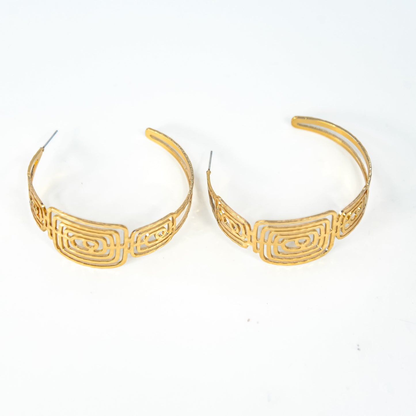 Pair of gold hoop earrings on a white background