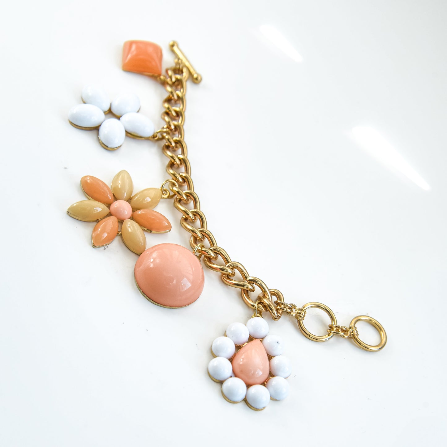Bracelet with floral charms on a white background