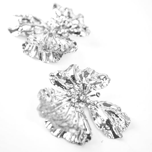 Pair of diamond earrings on a white background
