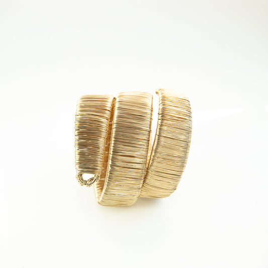 Gold bracelet on a white background