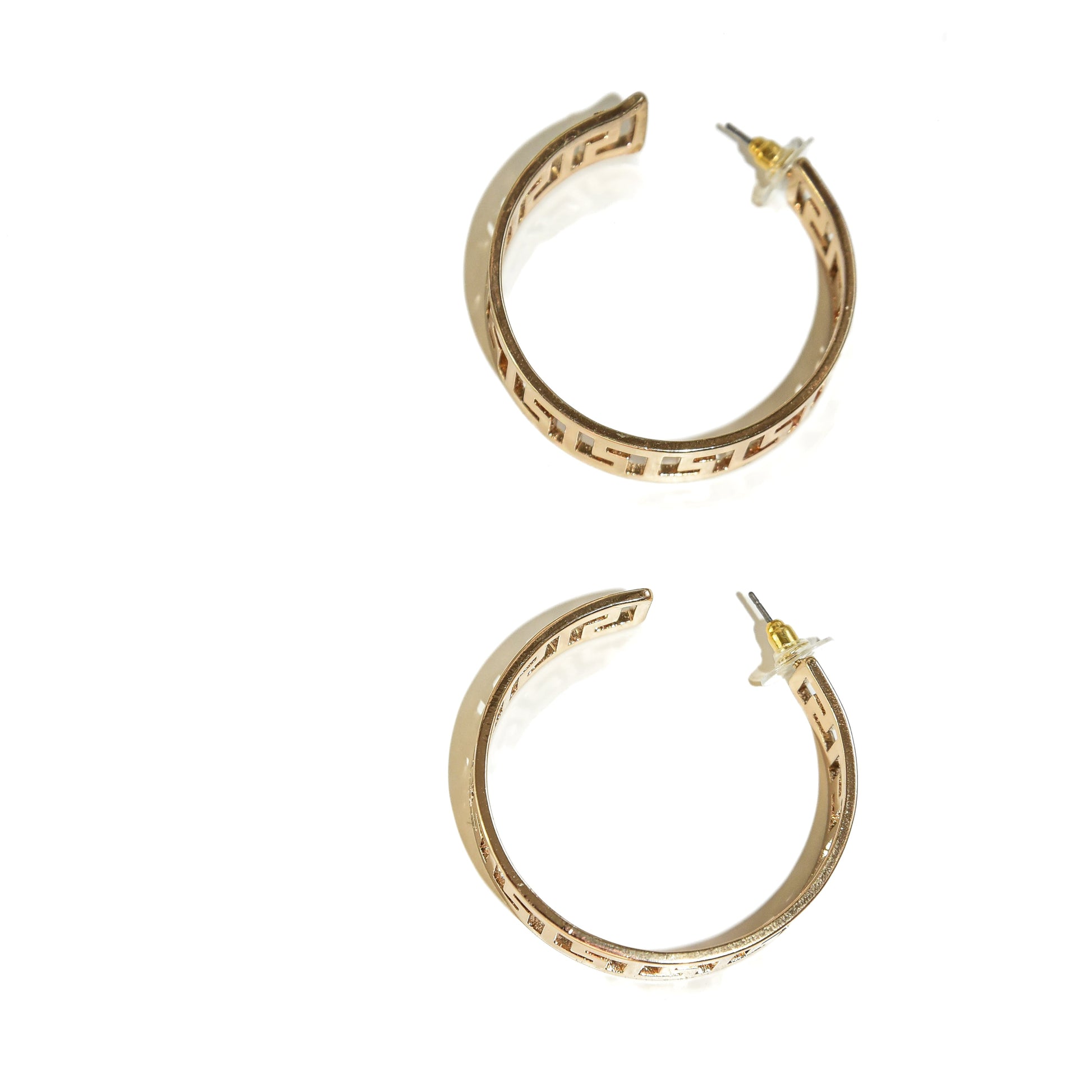 Gold hoop earrings on a white background