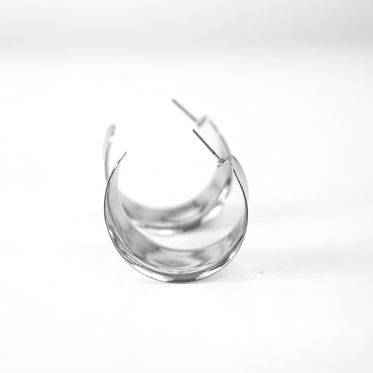 Clear glass earring on a white background