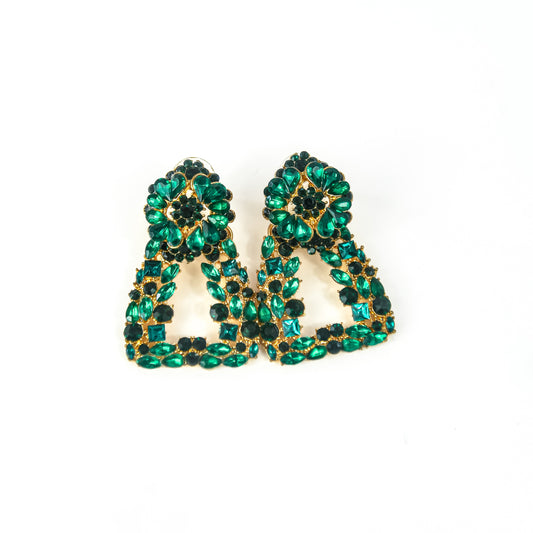 Pair of green rhinestone earrings on a white background