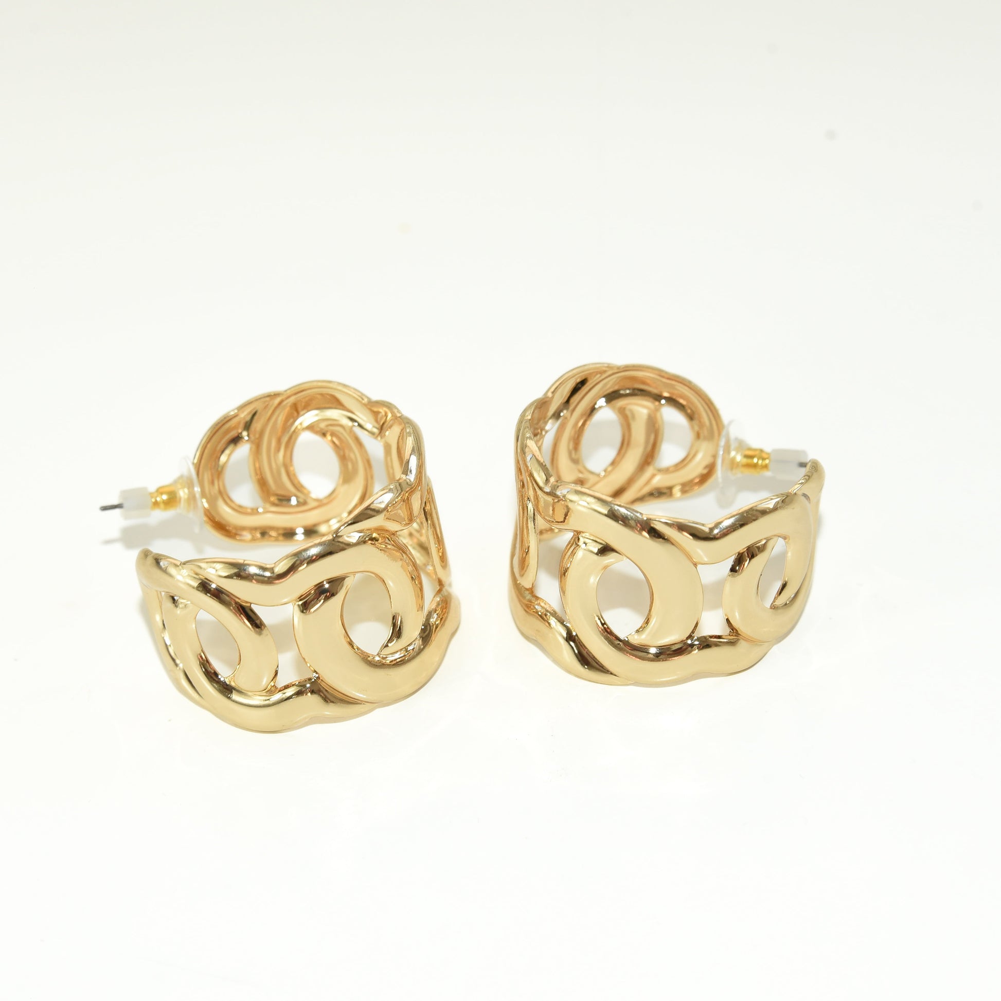 Gold hoop earrings on a white background