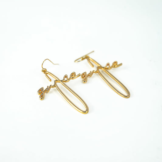 Gold earrings on a white background
