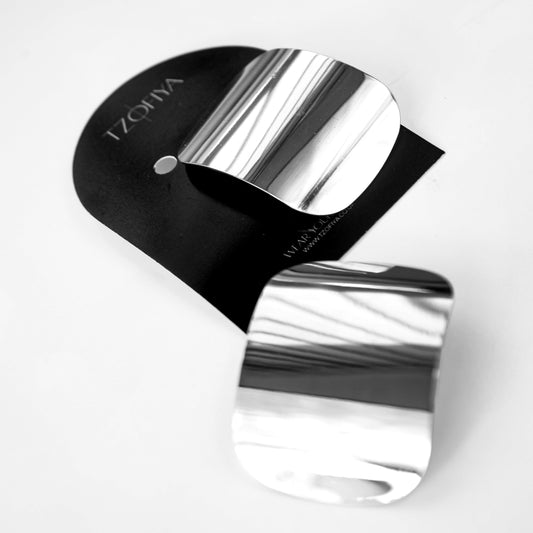 Silver and black device with 'Tzova' branding on a white background