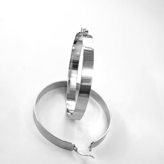 Silver hoop earrings on a white background