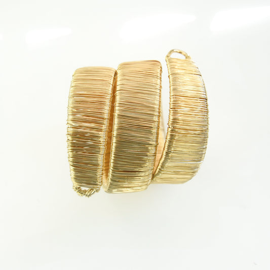 Gold bracelet on a white background