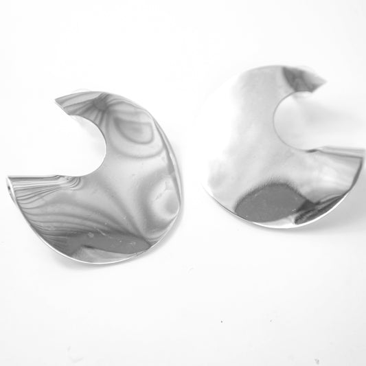 Pair of silver earrings on a white background